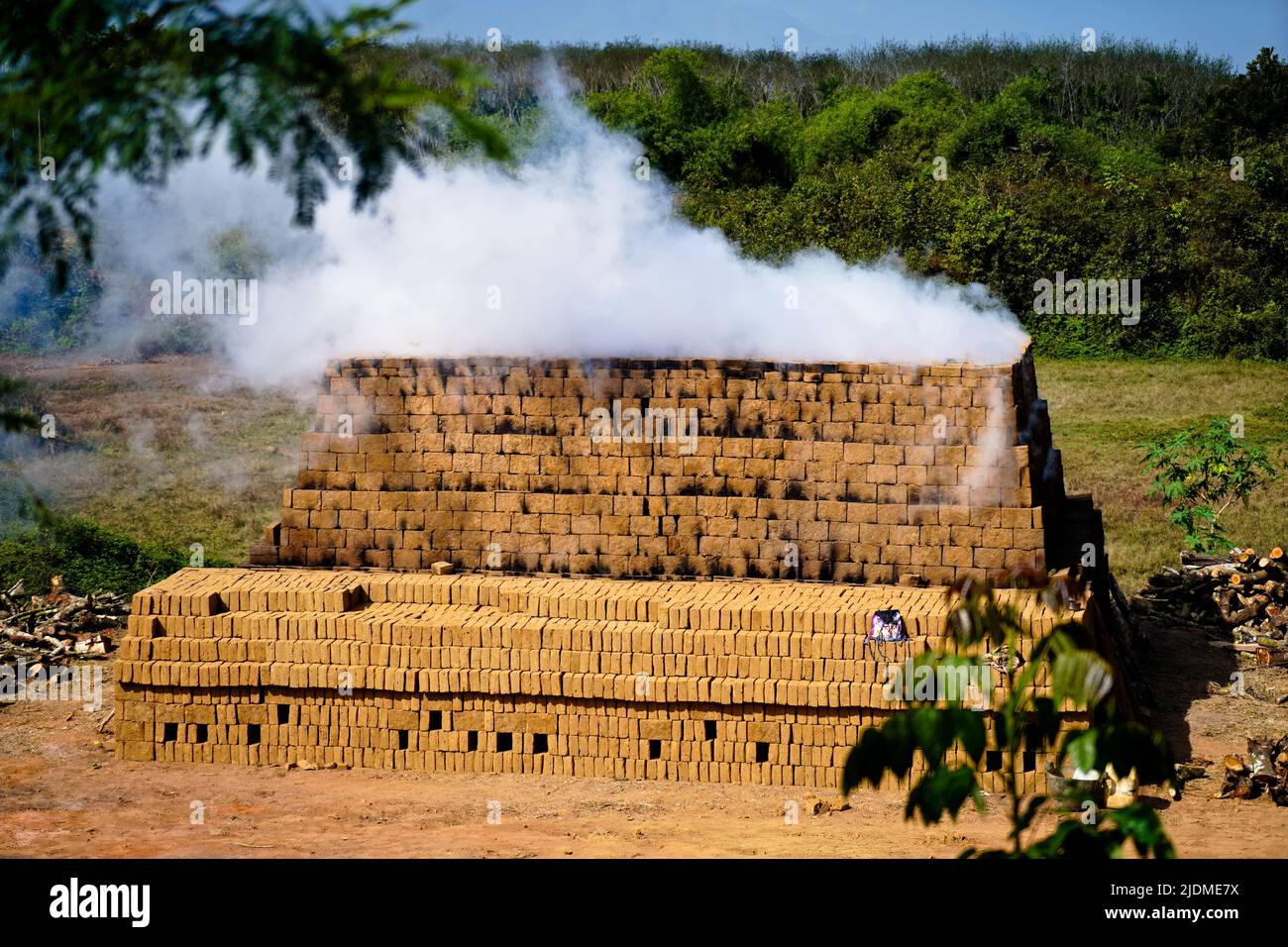 Drying and burning of bricks made of clay with fire wood, traditional way Stock Photo Alamy