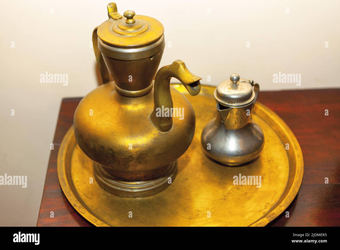 Ancient vessel for boiling water . Golden teapot Stock Photo Alamy