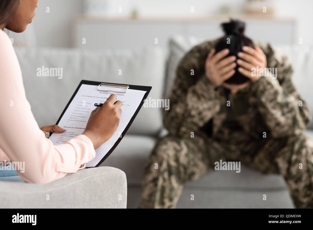 Black Psychiatrist Lady Filling Questionnaire During Therapy Meeting