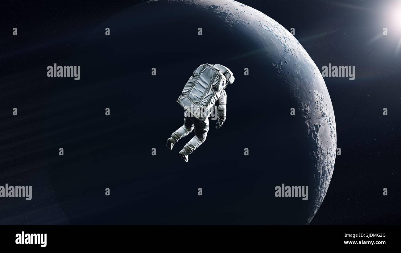 Cosmonaut is flying in outer space on Moon background. Elements of this image furnished by NASA. Stock Photo