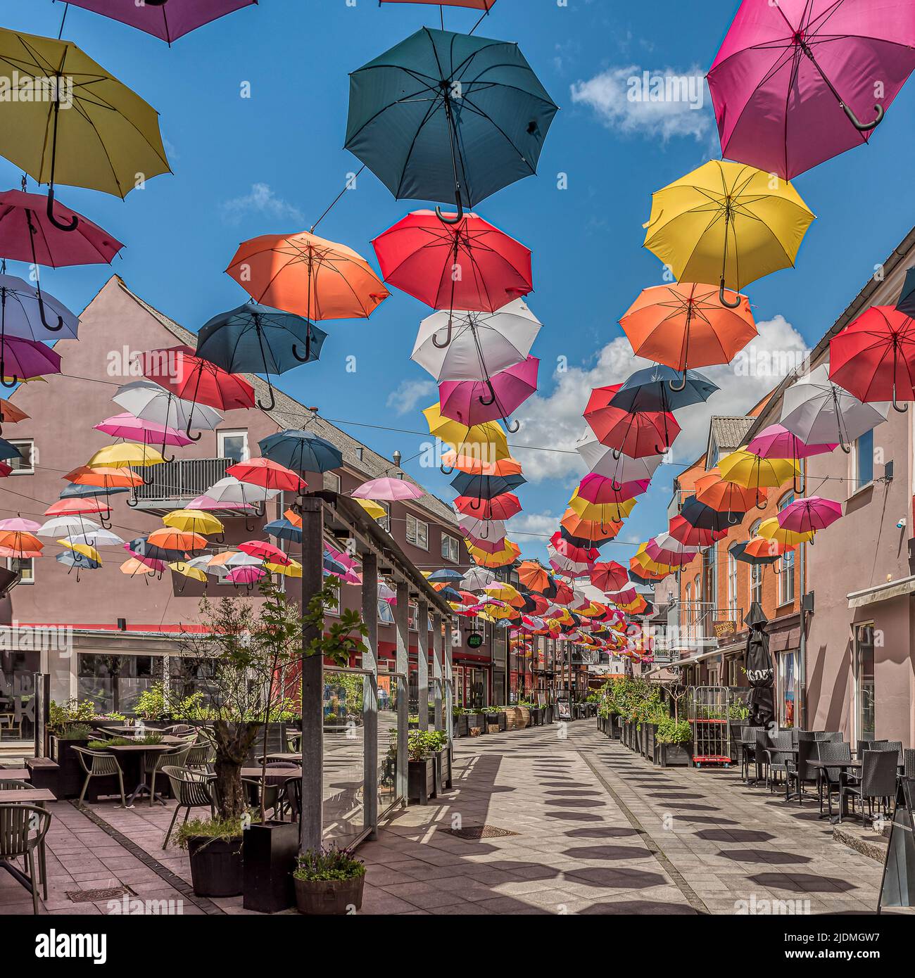 colorful umbrellas hanging over Vestergade in the Latin Quarter of Vejle, Denmark, June 13, 2022 Stock Photo