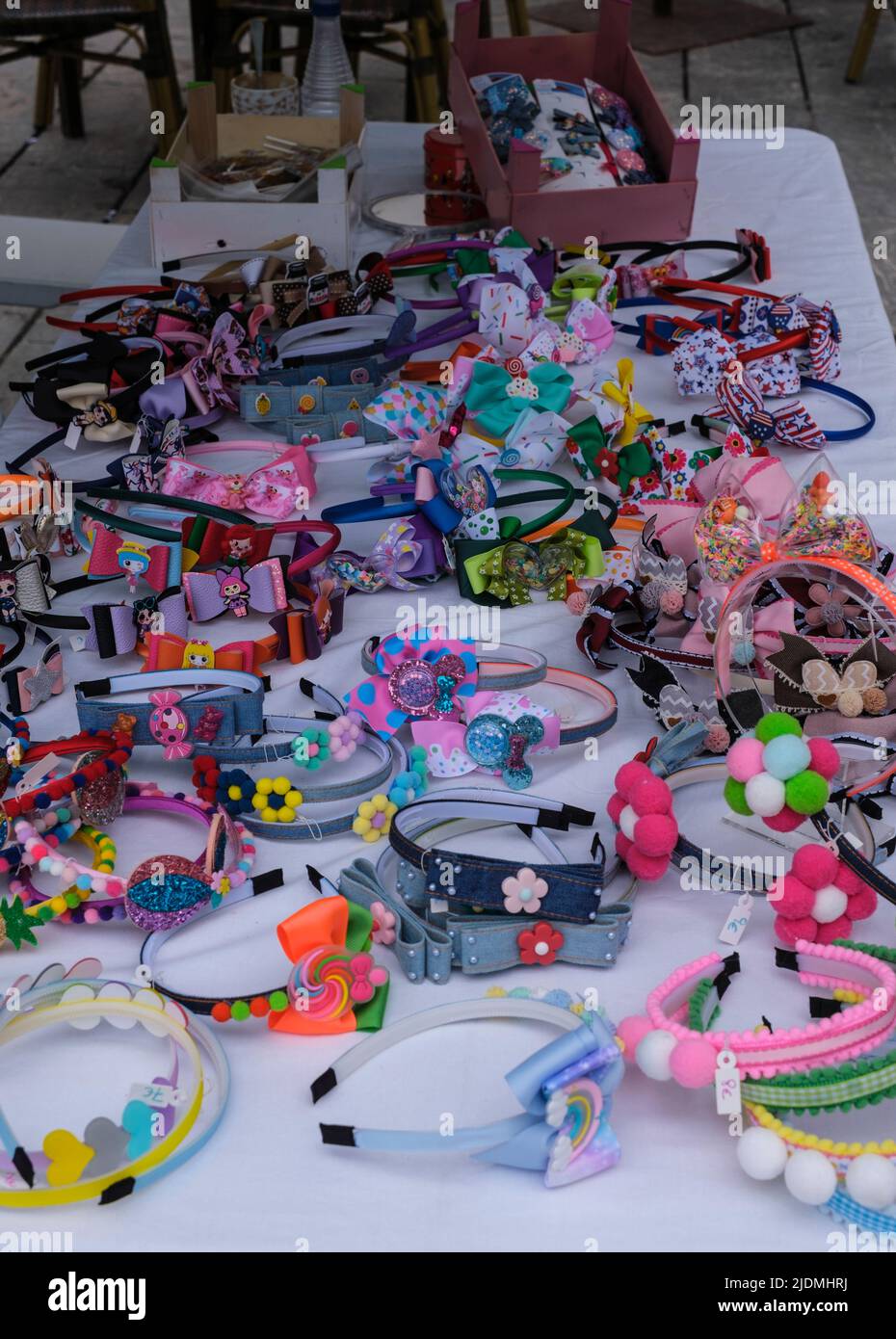 Spain, Leon. Bracelets, Headbands, Trinkets for Sale at Outdoor Market, Plaza Mayor. Stock Photo