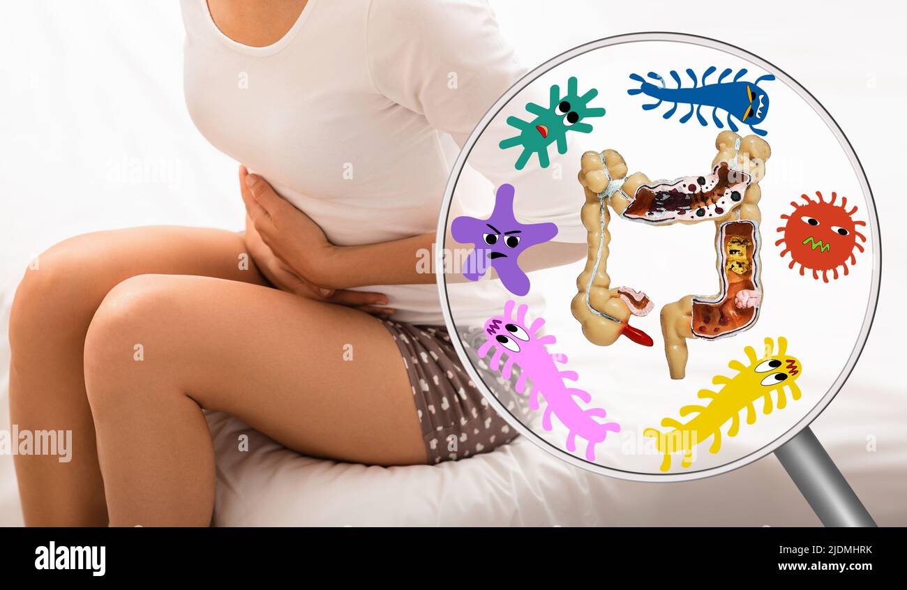 Pain in woman's intestines and abdomen. Dysbacteriosis, inflammation of intestines, abdominal bloating Stock Photo