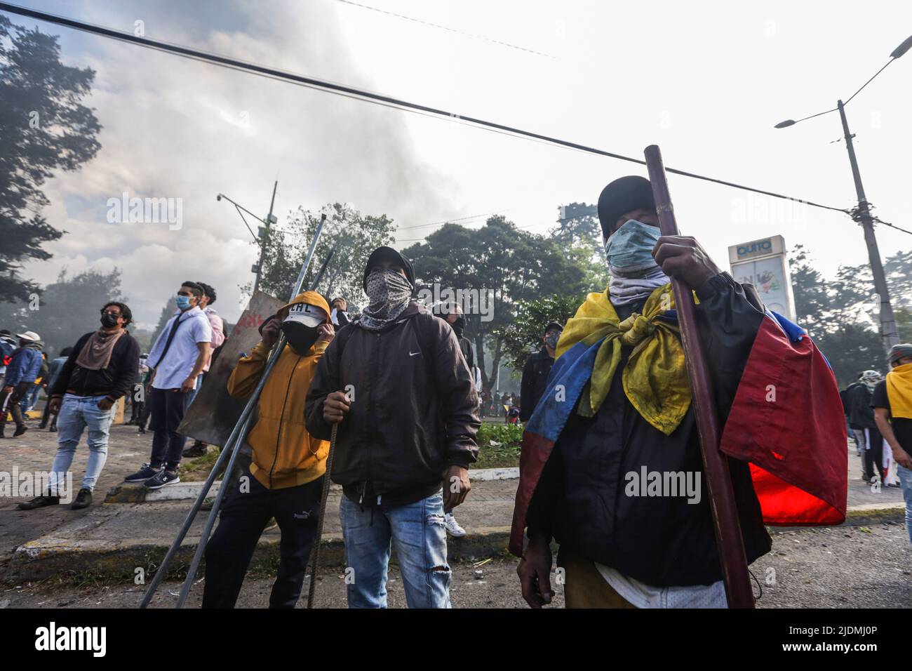Quito, Ecuador 21 Jun 2022, Masked protesters hold sticks during the