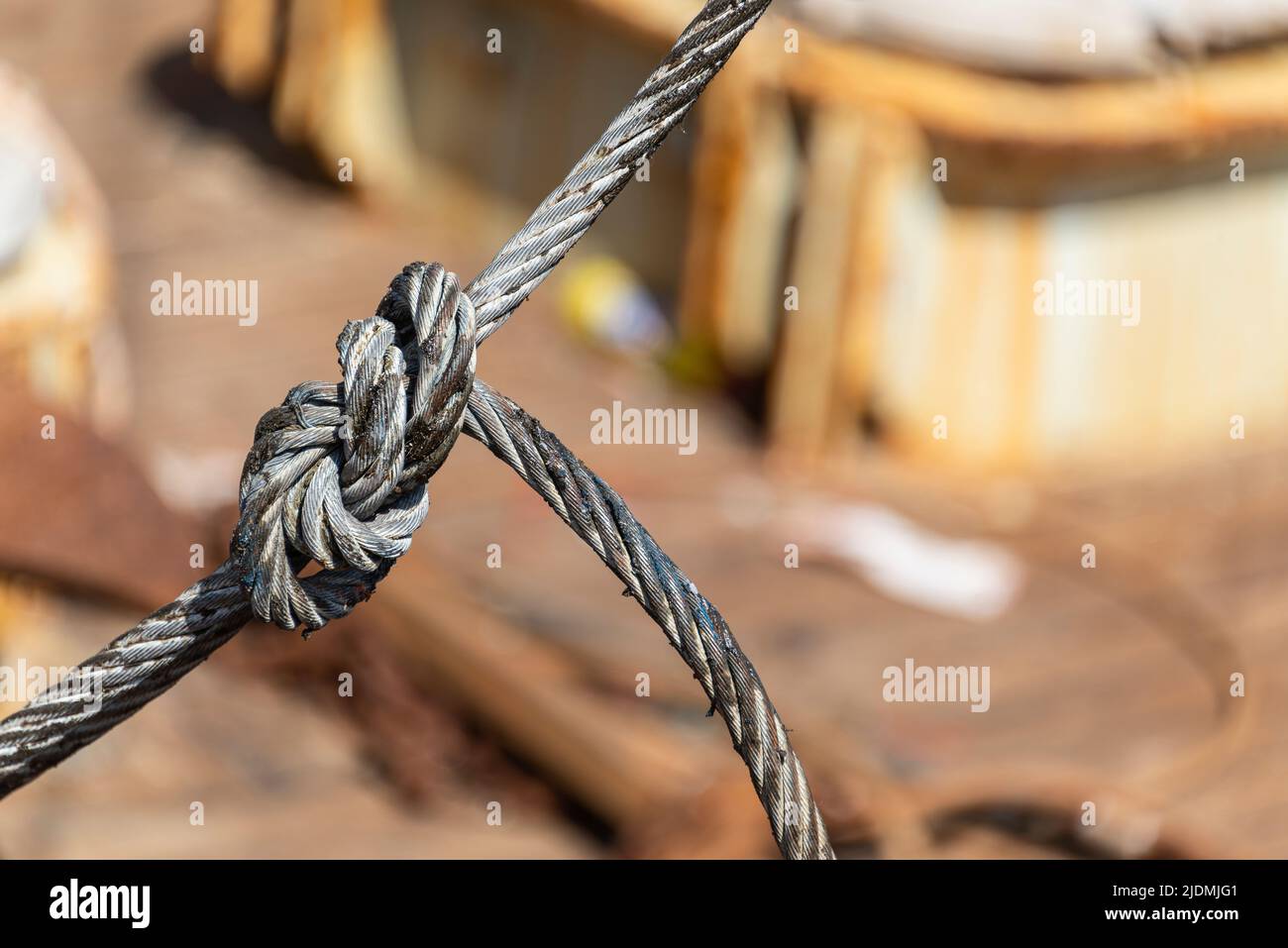 steel cable tied in a knot Stock Photo