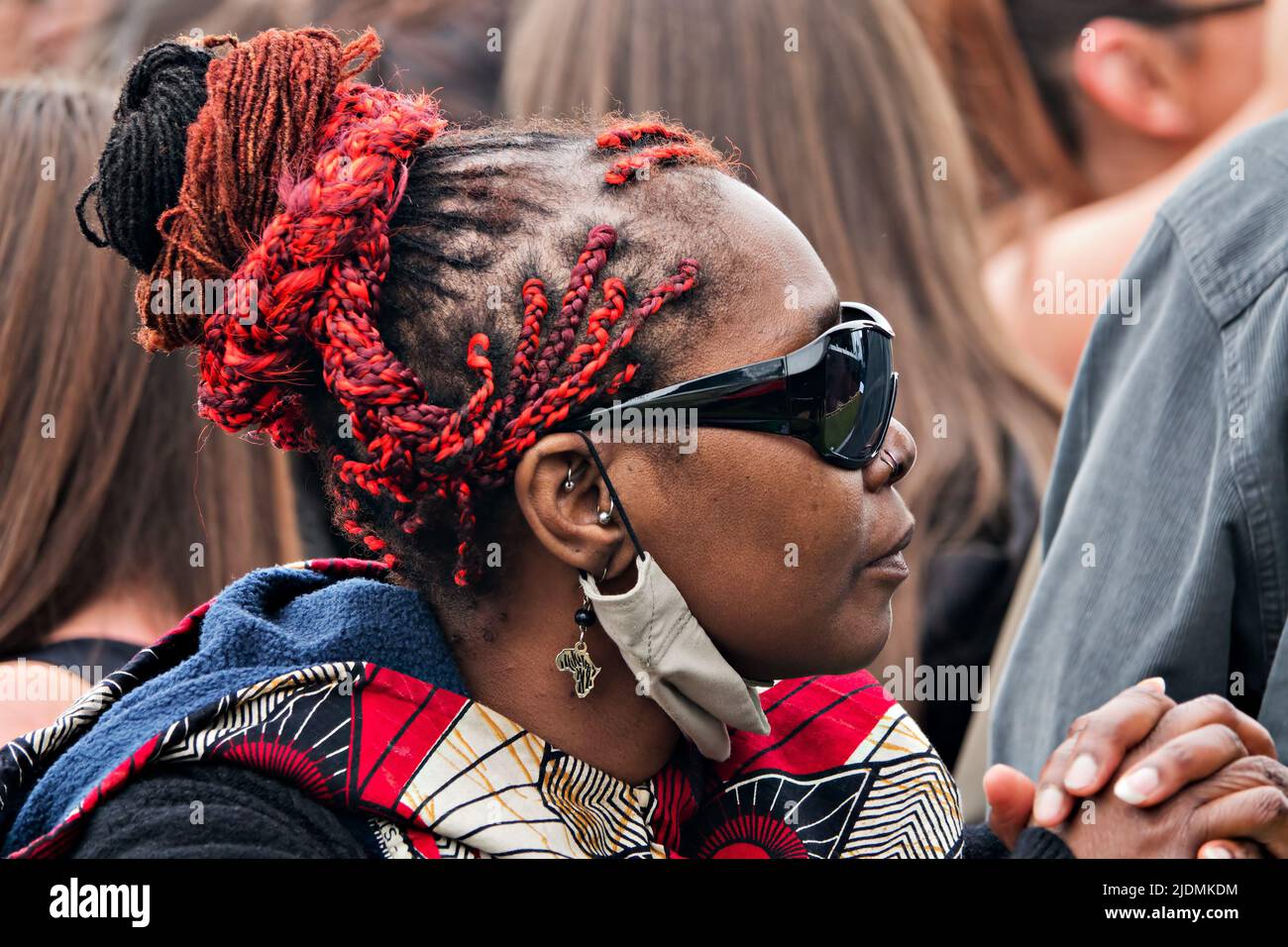 Woman in the crowd enjoying the music at the 2022 Africa Oye Music Festival in Sefton Park Liverpool UK Stock Photo