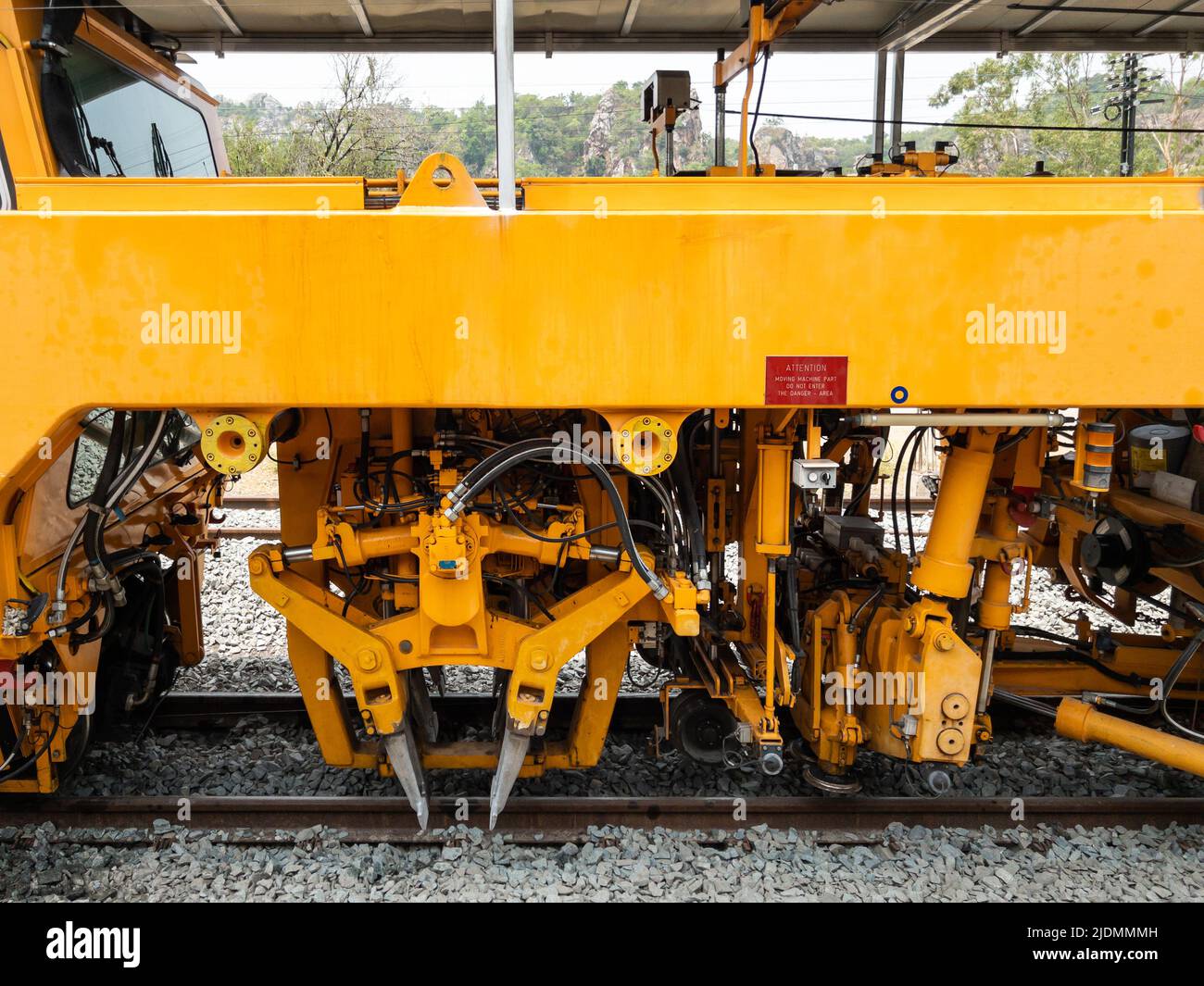 The ballast tamping machine is working to maintain the sleeper and
