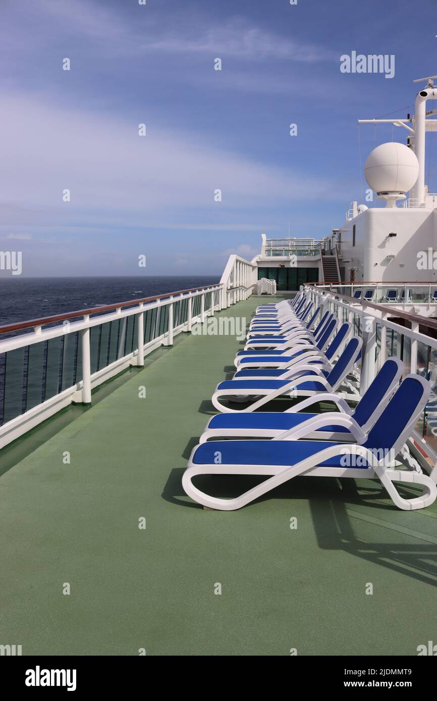 Nardi sun loungers await guests to descend on the Sun Deck of the P&O Aurora cruise ship Stock Photo