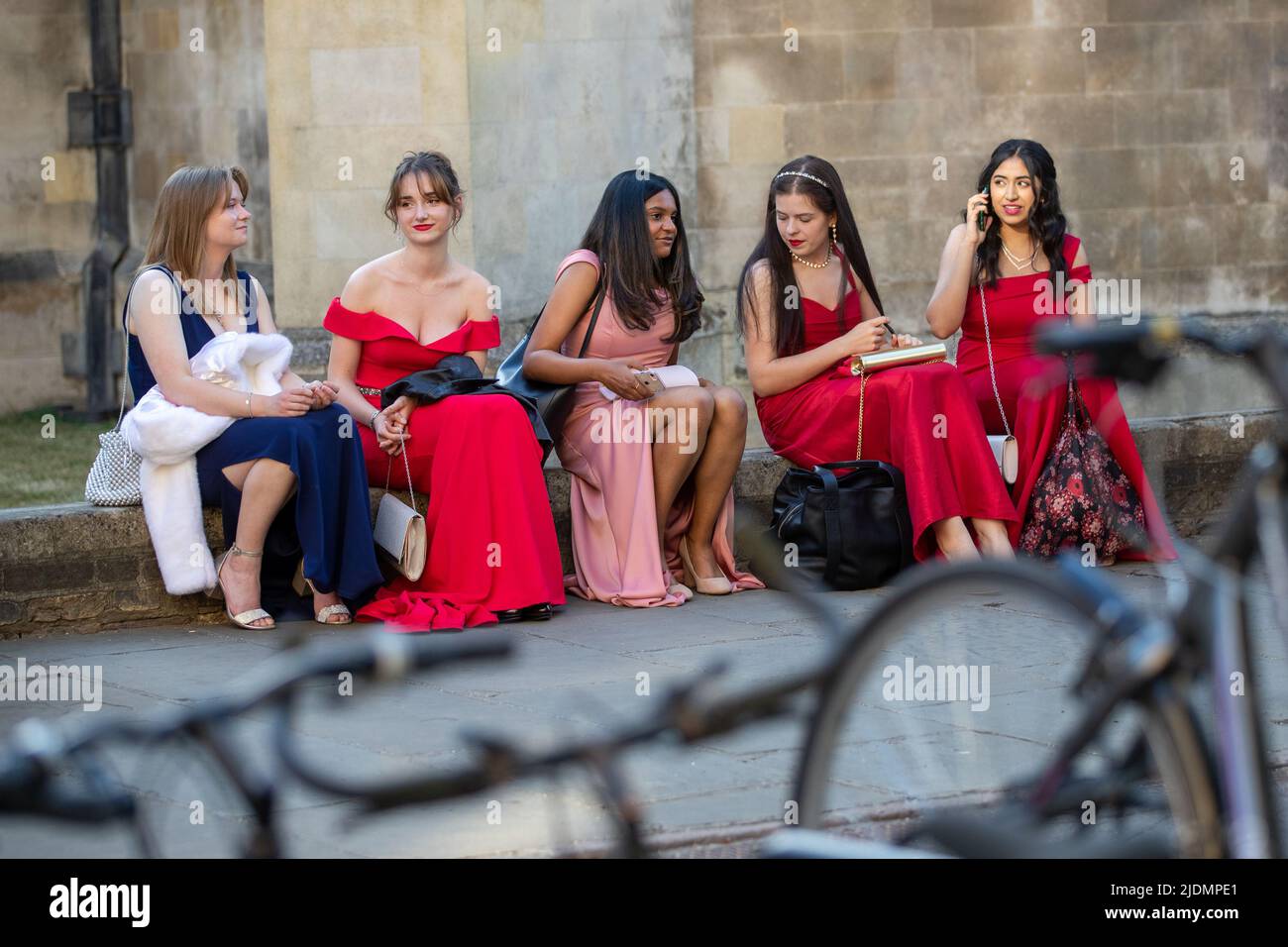 Picture dated June 20th shows Cambridge University students  on their way to the Trinity May Ball.  Rich Cambridge University students attended the Trinity May Ball last night (Mon) – for which tickets cost £450 a couple. Around 1800 undergraduates dressed in lavish ball gowns and tuxedos for the 156th lavish end-of-term party, which was back on after three years following Covid restrictions. The sold-out ball is the largest event of the Cambridge student social calendar and students enjoyed music from headliner Priya Ragu, Anish Kumar, Emily Nash and Abba Revival, as well as a spectacular fir Stock Photo