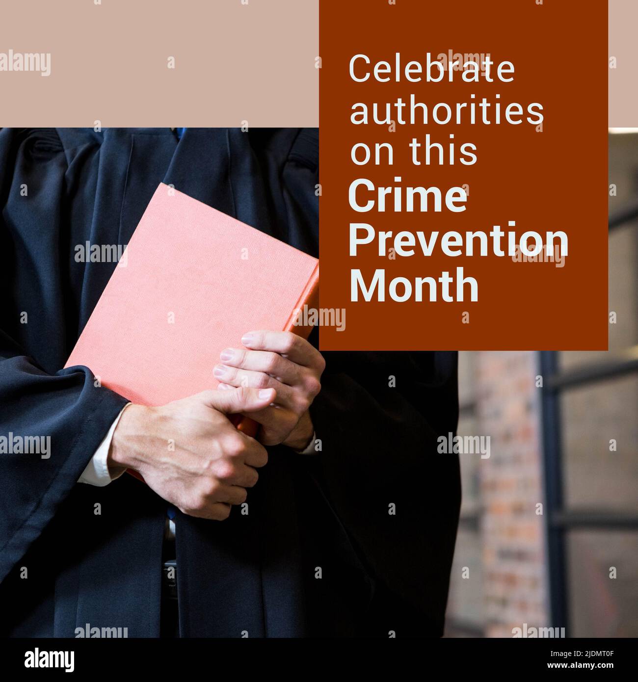Midsection of caucasian lawyer holding book and celebrate authorities on this crime prevention month Stock Photo