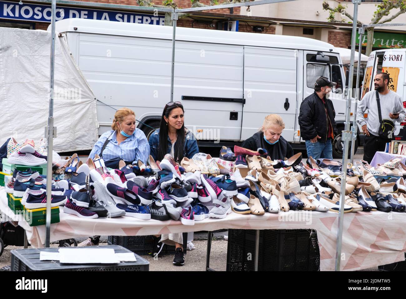 Spain, Astorga, Castilla y Leon. Tuesday Market, Shoe Vendor. Stock Photo