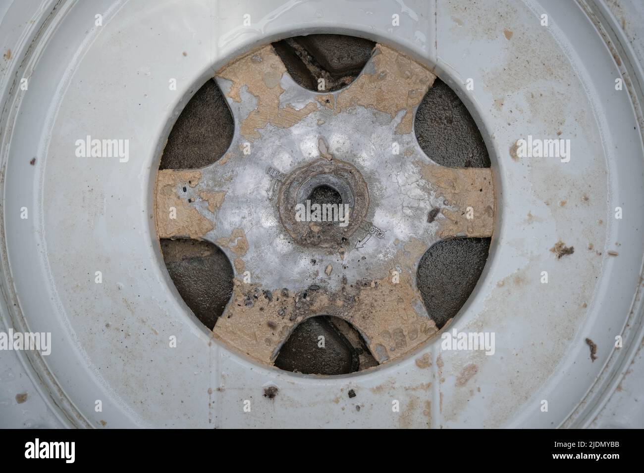 Inside of the washer drum is dirty stains, musty smell, household