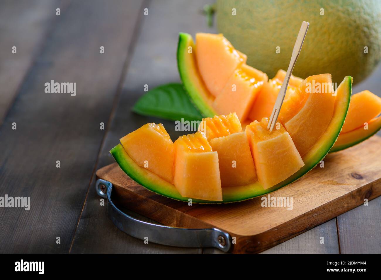 Fresh honey dew or melon slice fruit isolated on white background with  clipping path Stock Photo