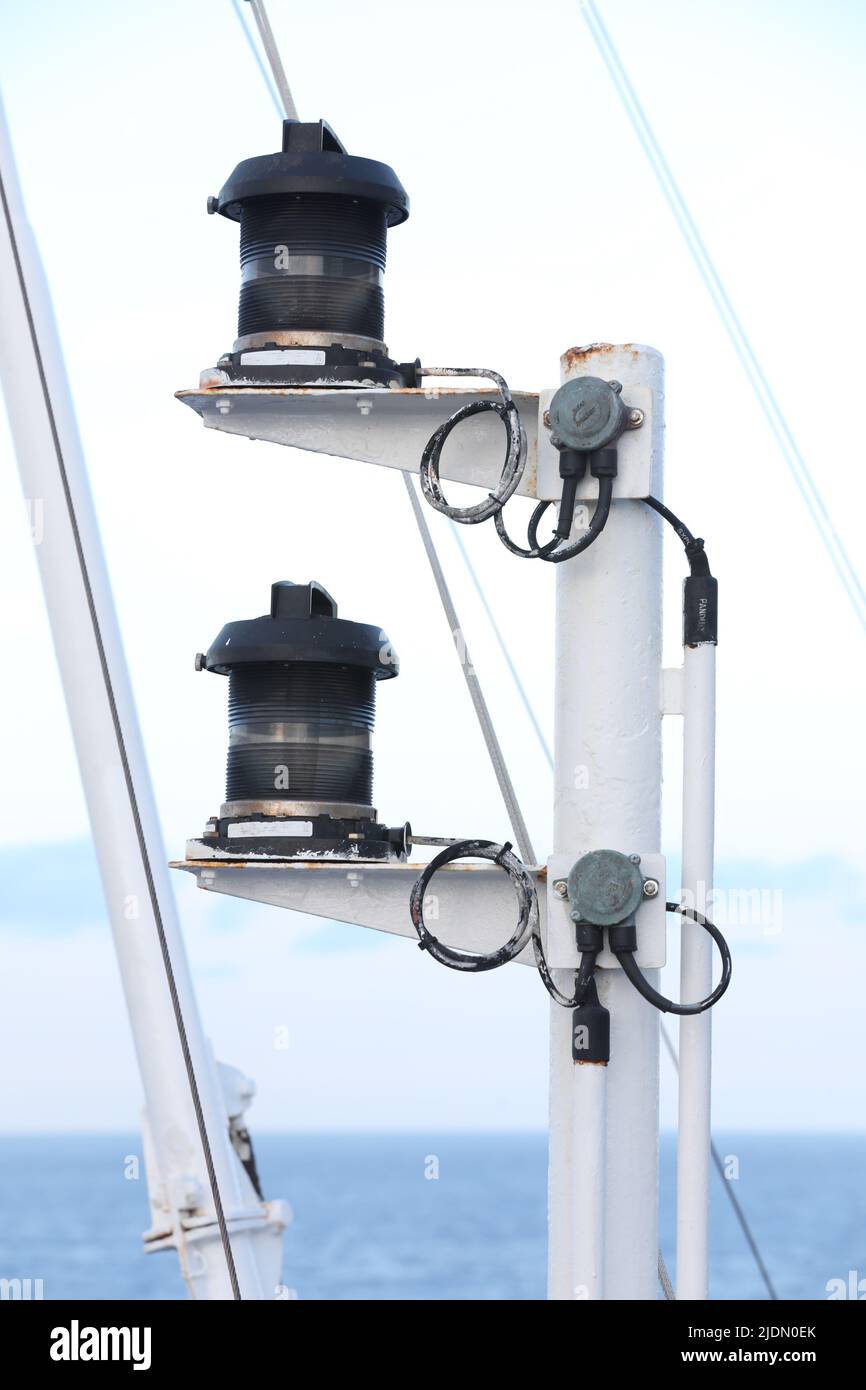 Navigation and radar equipment and antenna on the mast of cruise ship Stock Photo