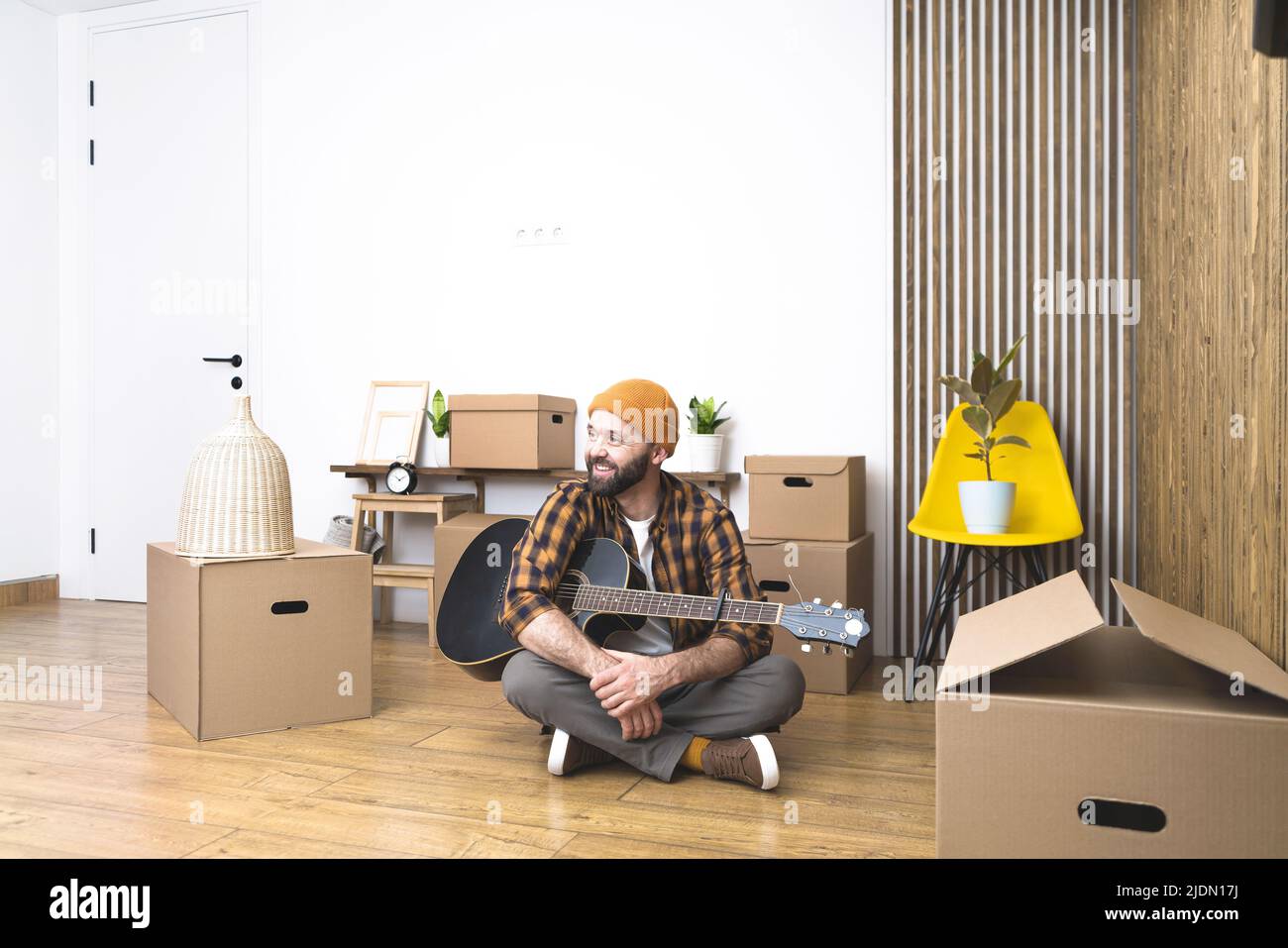 Hipster Man With Moving Boxes In New Modern Apartment Mature Man Unpacking Things From Boxes