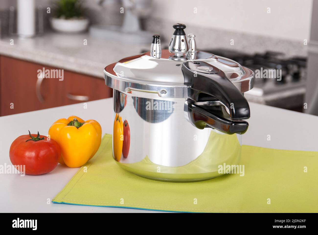 Double valve pressure cooker on white background Stock Photo Alamy