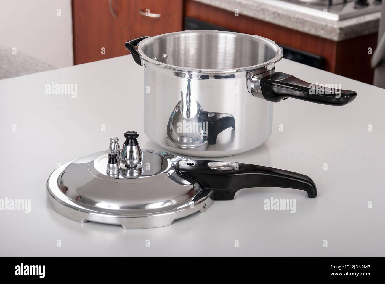 Double valve pressure cooker on white background Stock Photo Alamy