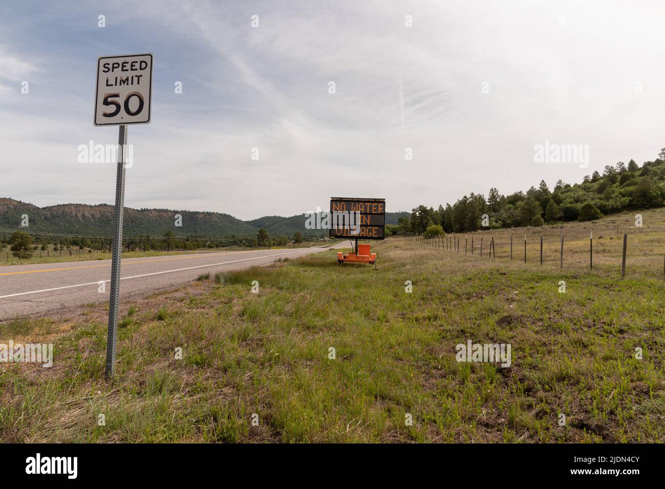 A sign on Highway 64 in Rio Arriba County reads No Water in Village. The Village of Chama, NM, is out of water reportedly due to a leak in the system. Stock Photo
