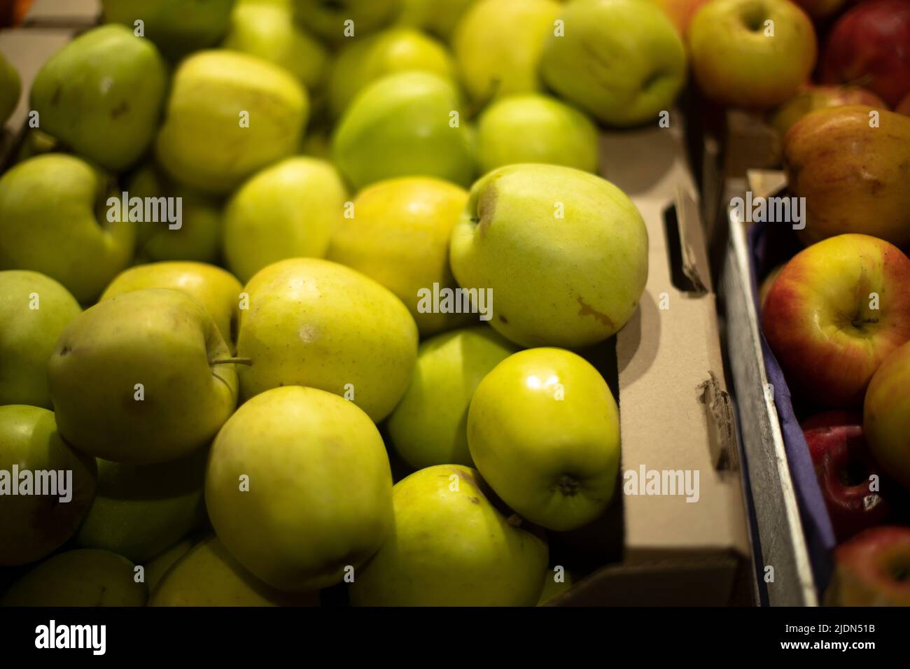 Apples in store. Lots of apples in drawer. Fresh fruit. Summer vitamins. Stock Photo