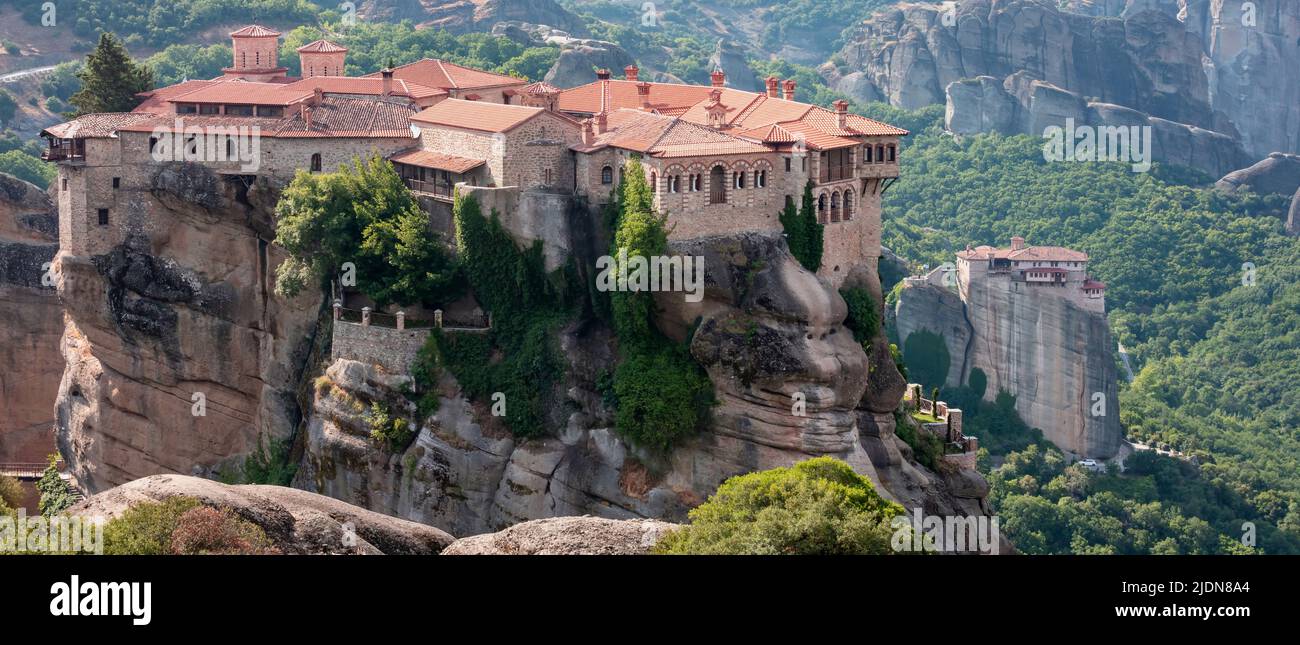 Meteora Greece. Varlaam Holy Monastery and buildings on top of rocks, close up view. Also view of Rousanos Monastery. Europe religion travel destinati Stock Photo