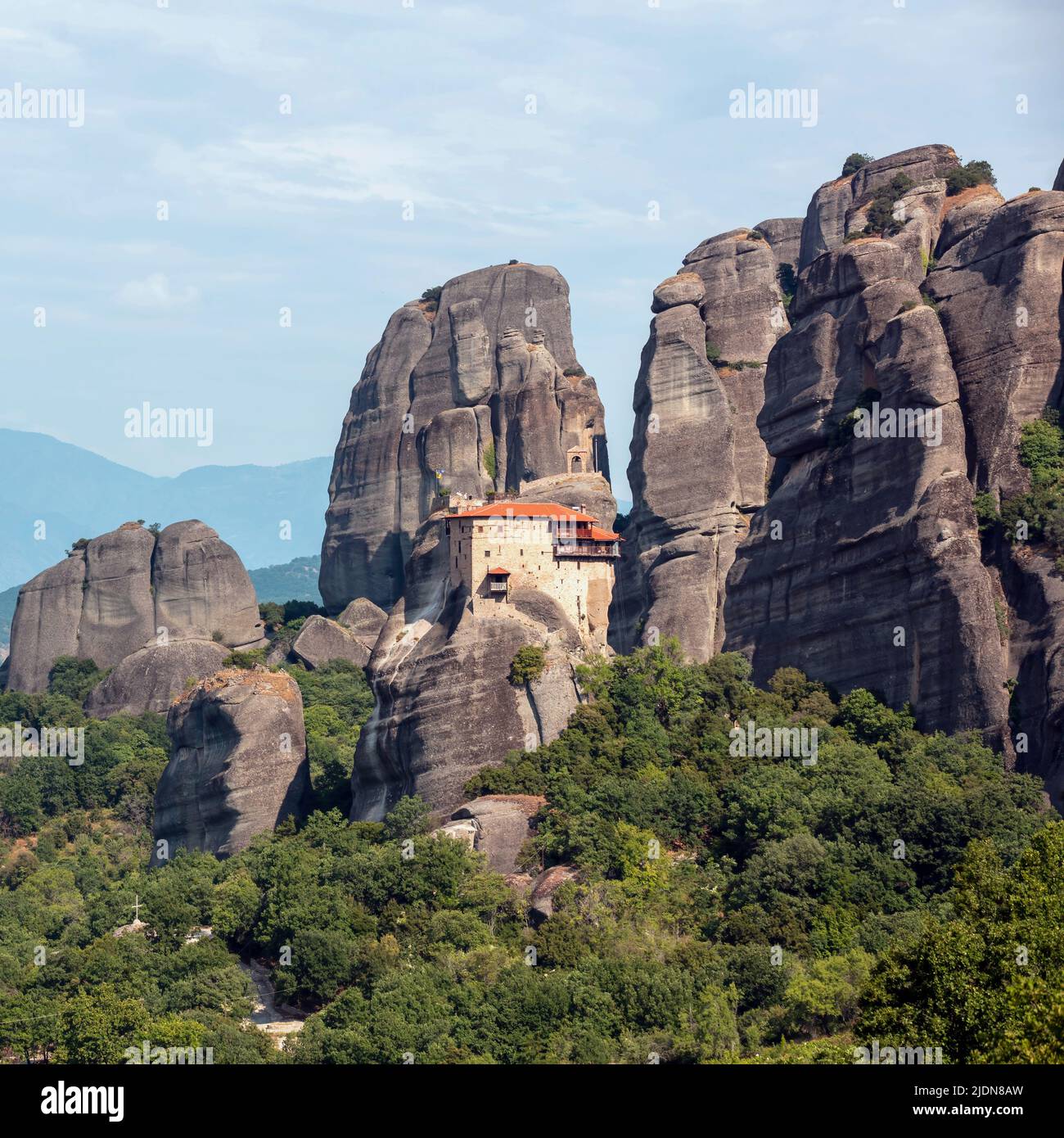 Meteora Greece. Holy Monastery of Saint Nicholas Anapafsas buildings on top of rocks, Europe religion travel destination Stock Photo