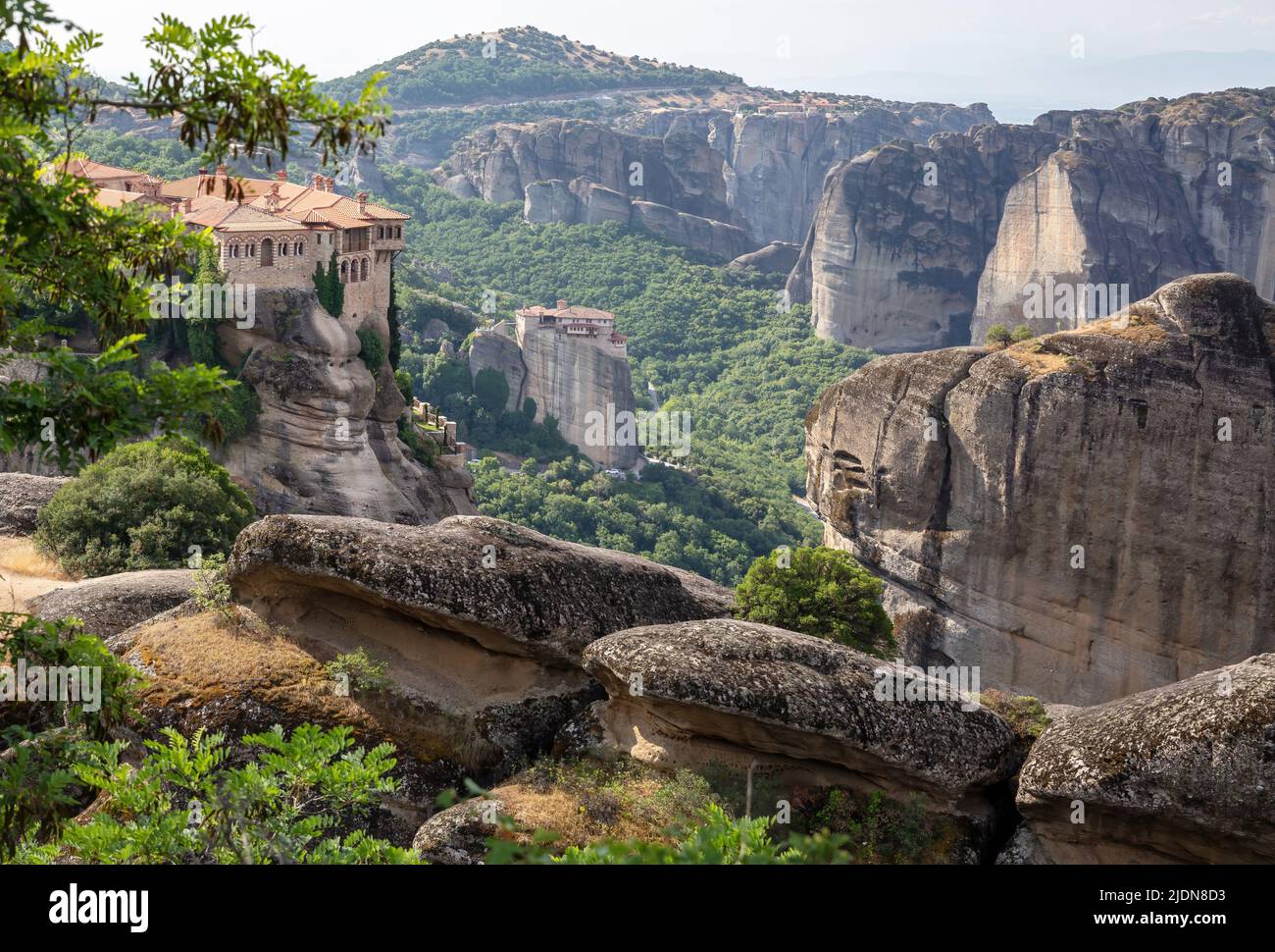 Meteora Greece. Varlaam Holy Monastery and buildings on top of rocks. Also view of Rousanos Monastery. Europe religion travel destination Stock Photo