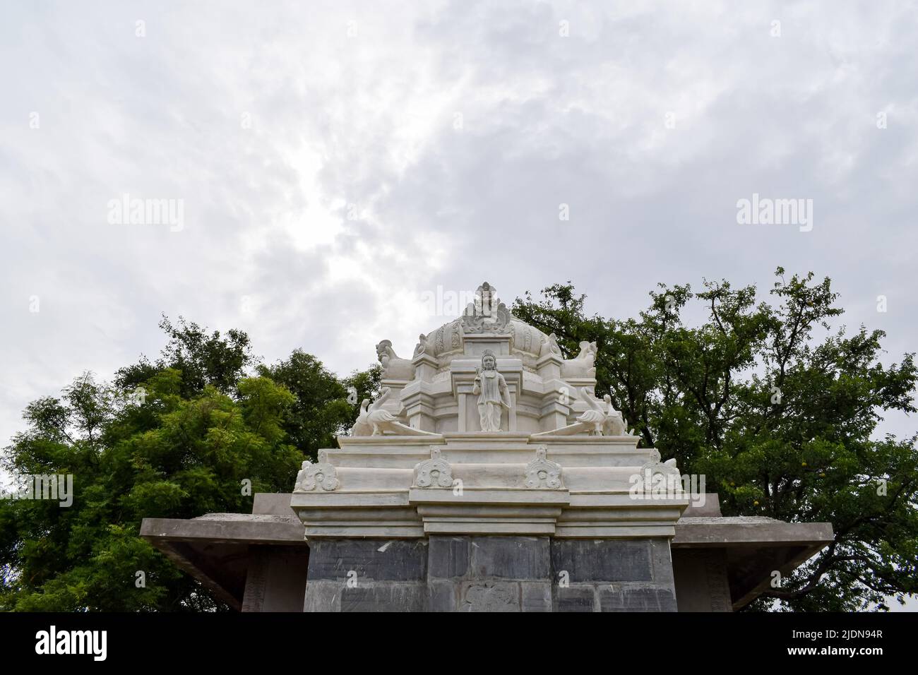 Indian small marble temple and the sky. Concept -Hindu Devotion. Stock Photo