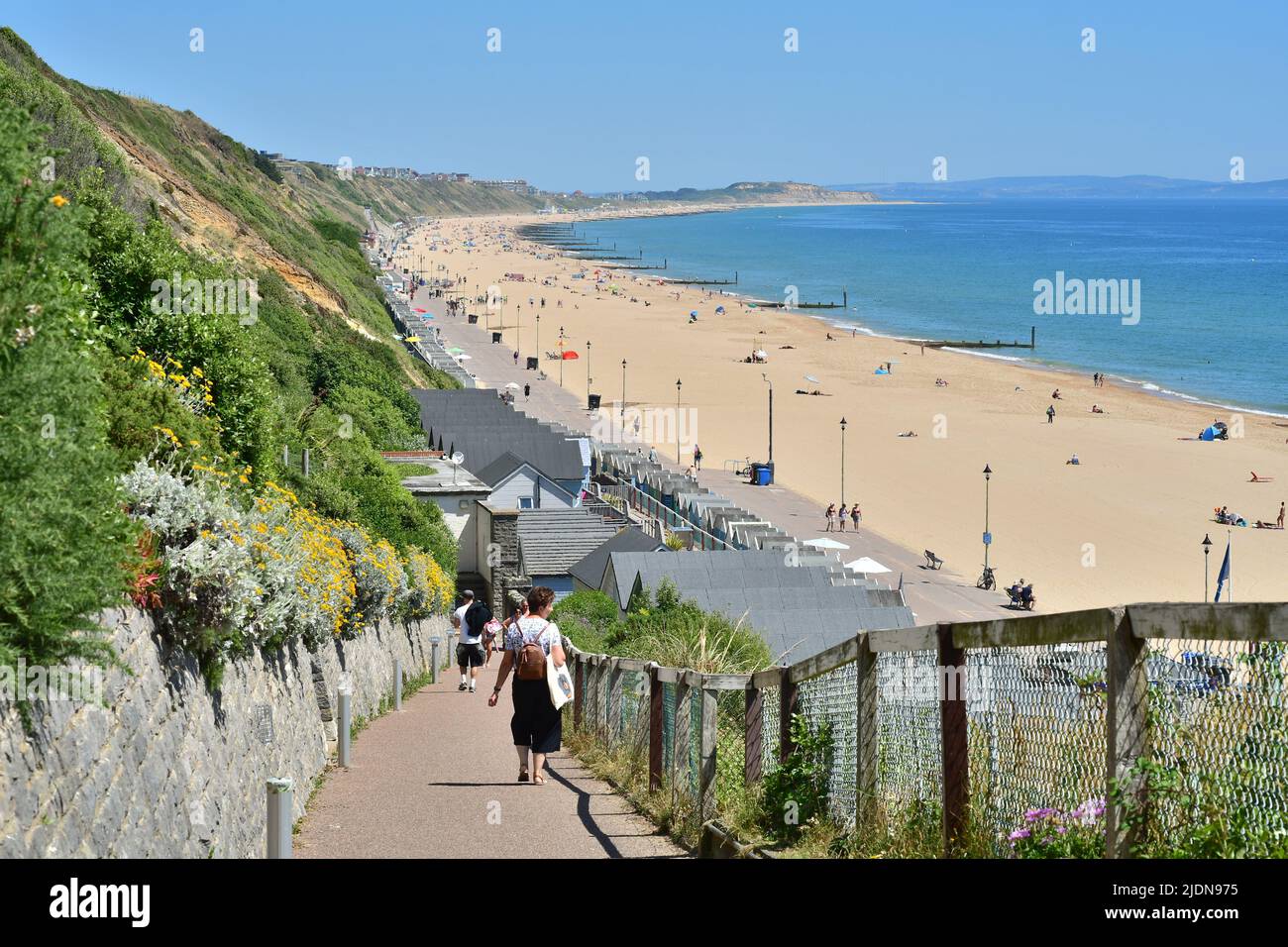 Boscombe, Bournemouth, Dorset, UK, 22nd June 2022, Weather. Hot afternoon in glorious summer sunshine. Heading to the long beach to Southbourne and Hengistbury Head. Credit: Paul Biggins/Alamy Live News Stock Photo