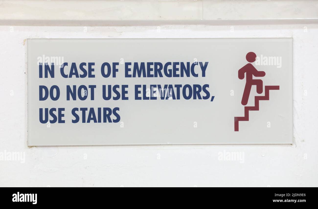 In Case of emergency Use Stairs Do Not Use Elevators Sign with Warning Message for Industrial Areas Stock Photo