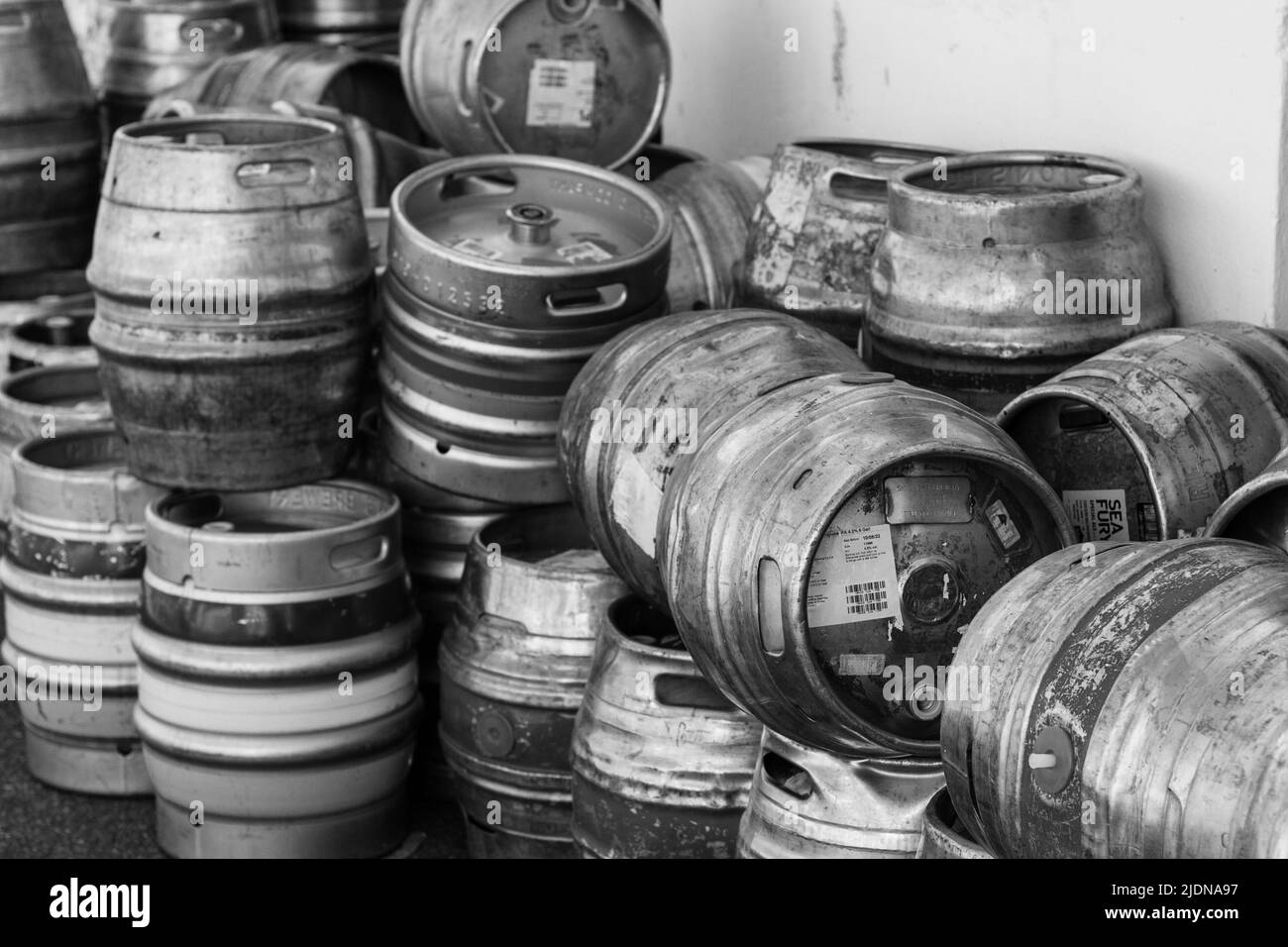 Metal beer kegs stacked outside of a pub Stock Photo Alamy