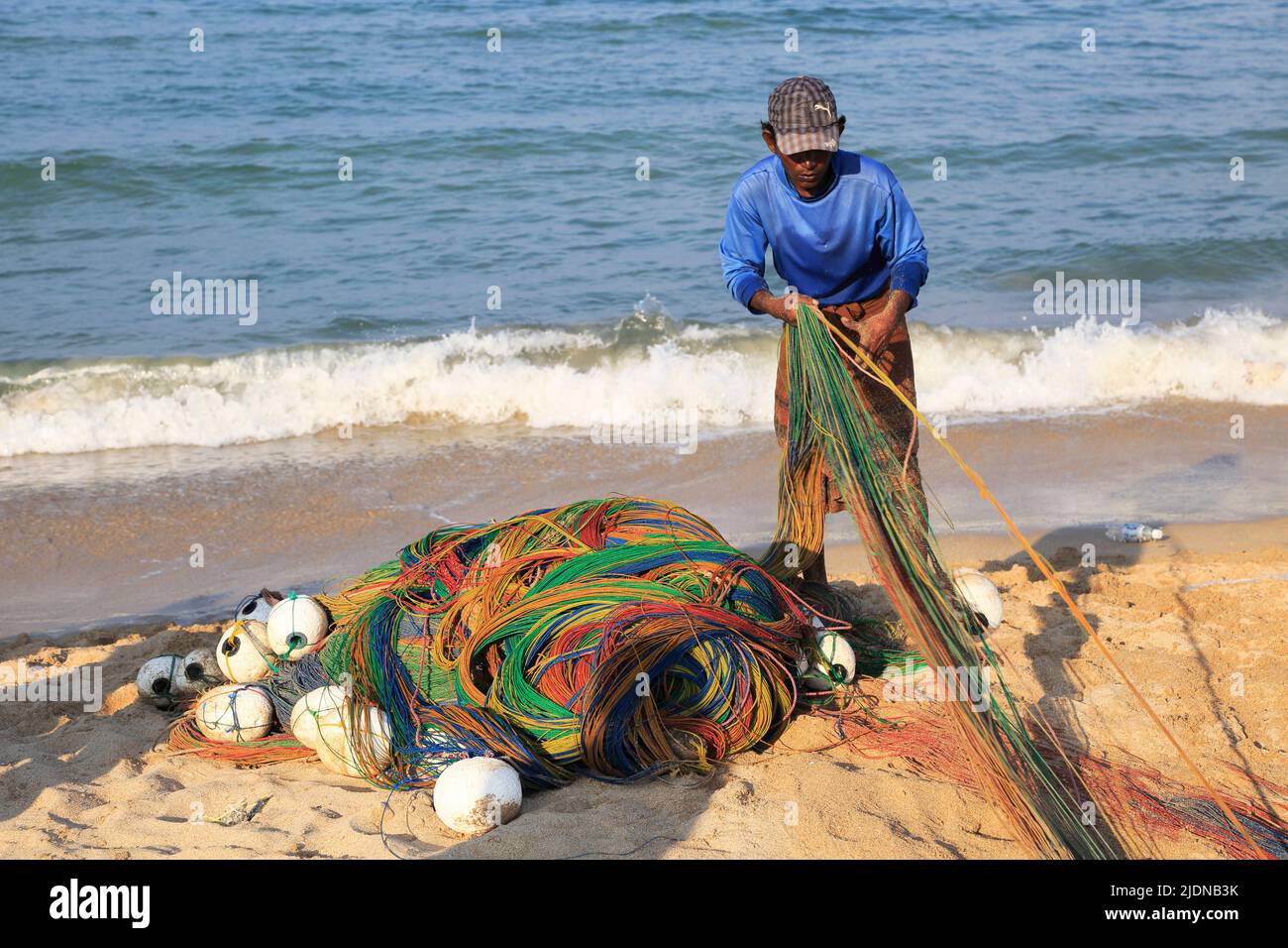 Traditional fishing hauling nets Nilavelli beach , near