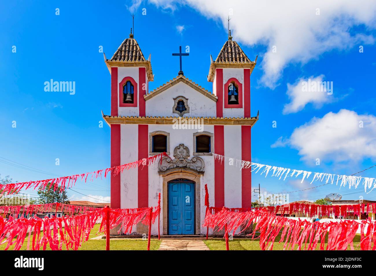 Small colonial-style chapel decorated with ribbons for a religious celebration in the small town of Lavras Novas, Ouro Preto district in Minas Gerais Stock Photo