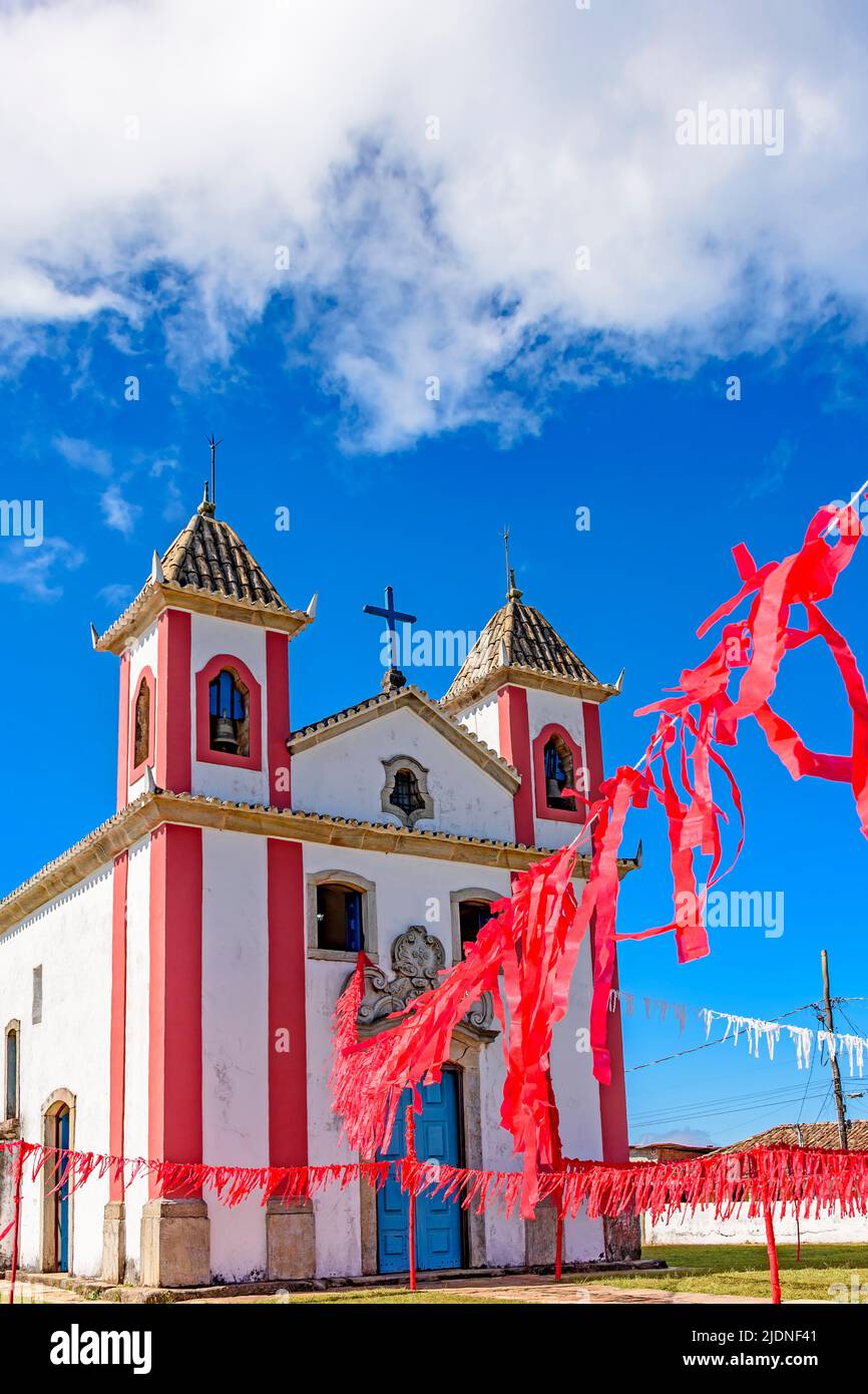Small simple colonial-style chapel decorated with ribbons for a religious celebration in the small town of Lavras Novas, Ouro Preto district in Minas Stock Photo