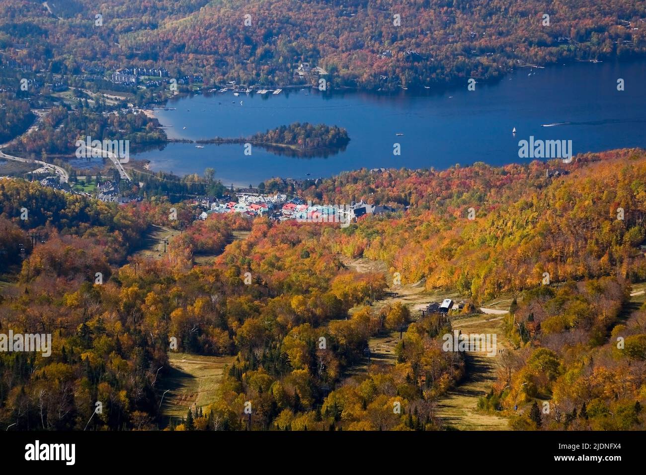 High-angle view of Mont-Tremblant lake and resort in autumn taken from the summit of Mont-Tremblant, Laurentians, Quebec, Canada. Stock Photo