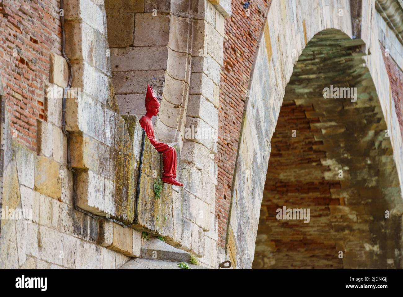 Toulouse, France. May 24, 2022. This little red man sculpture by French artists James Colomina located in the Pont-Neuf in Toulouse France. Stock Photo