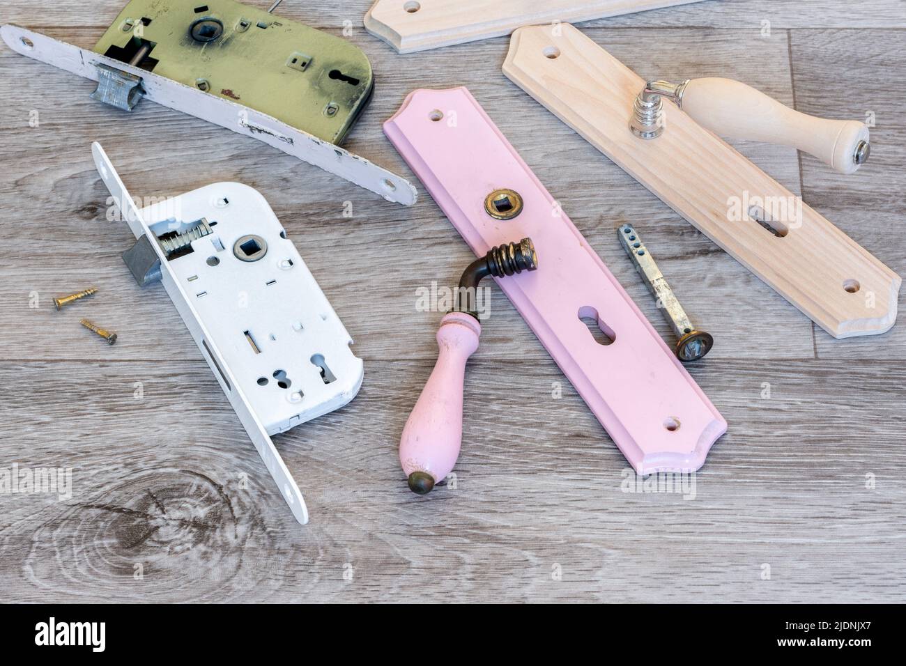 Interior renovation. Replacement of a door lock and handle Stock Photo