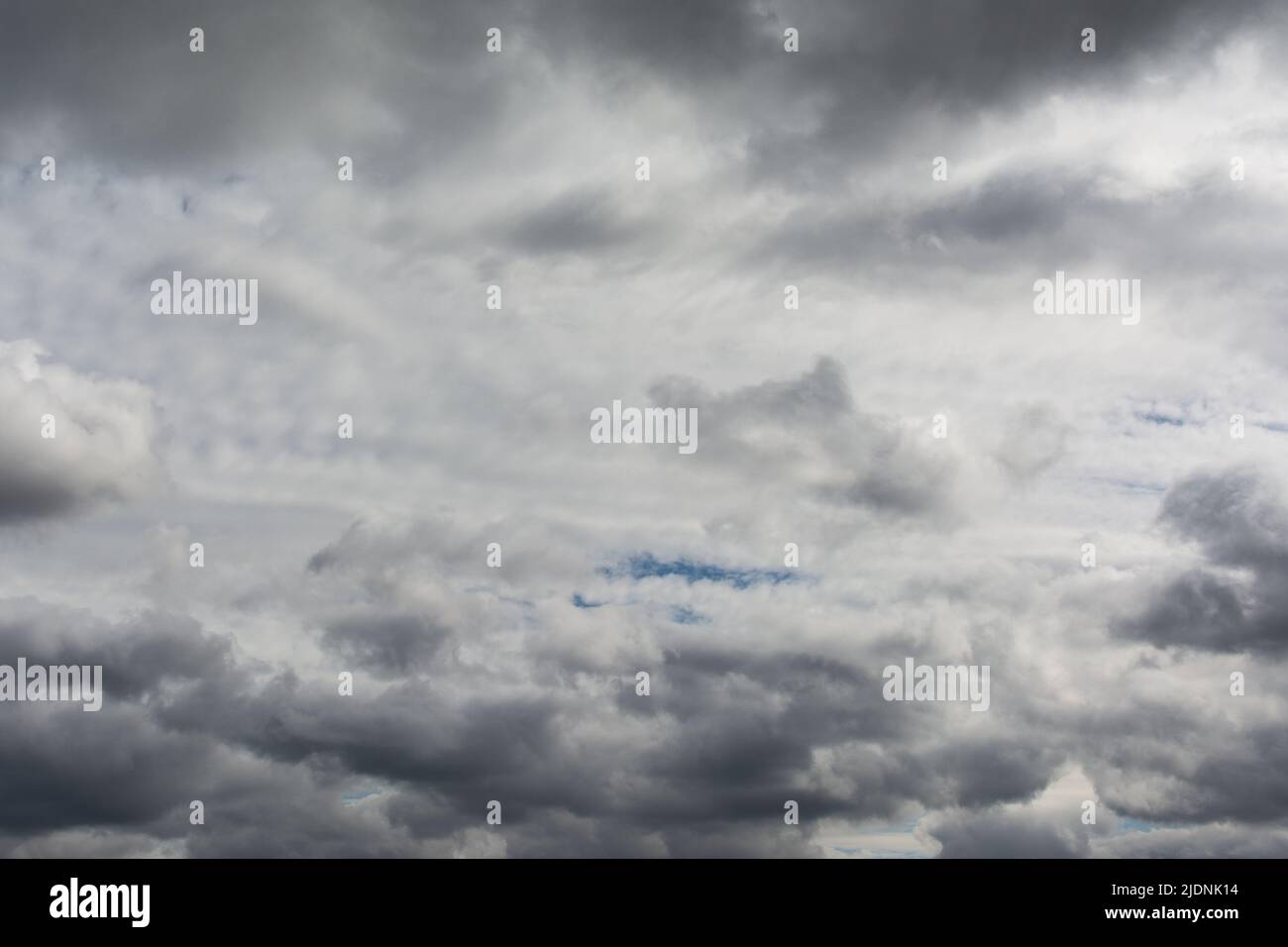 Very cloudy sky. Dark clouds before the storm. Stock Photo