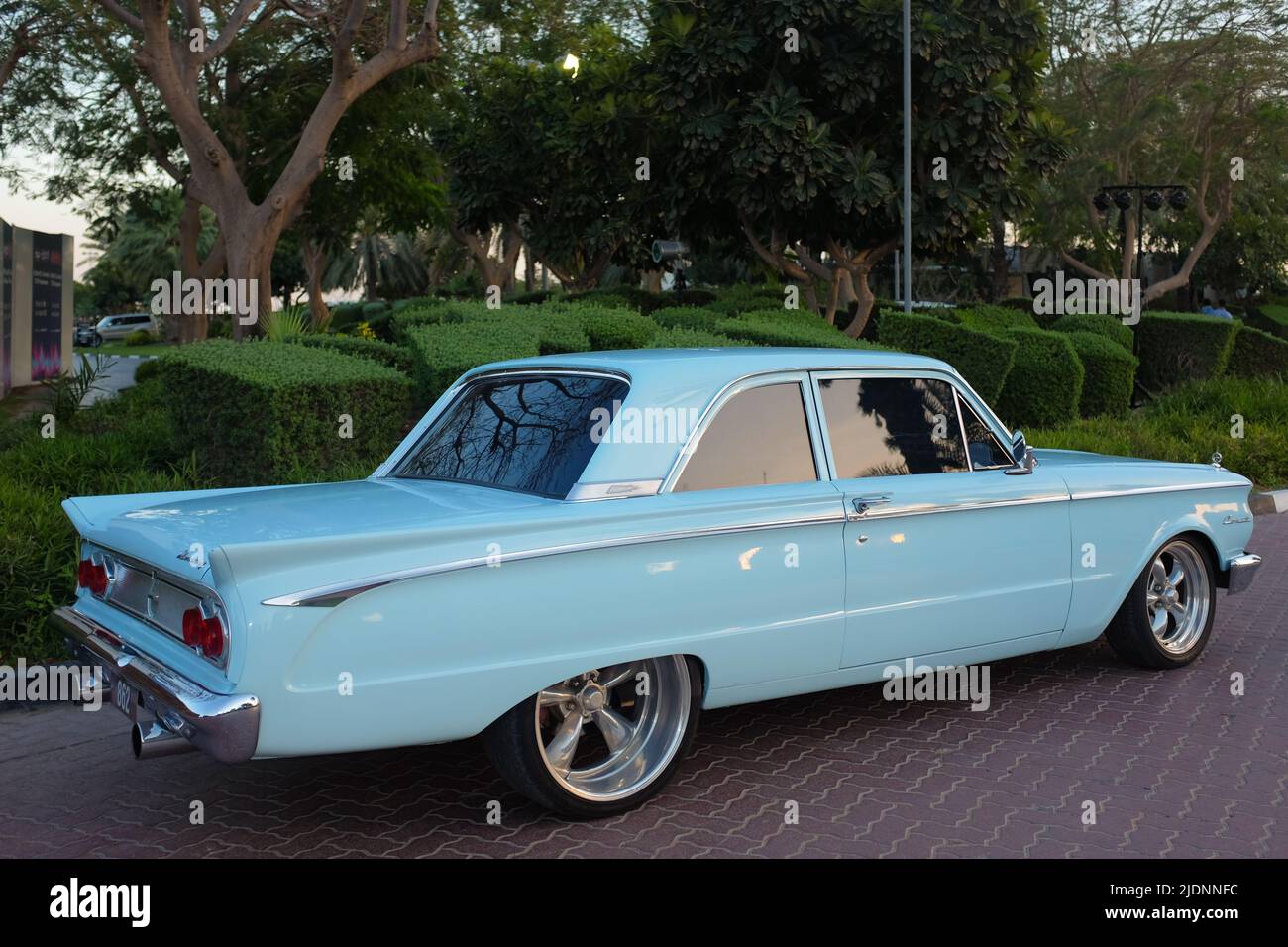 Dubai, United Arab Emirates - March 26, 2016: light blue antique Ford Mercury Comet parked in Emirates Golf Club. Stock Photo