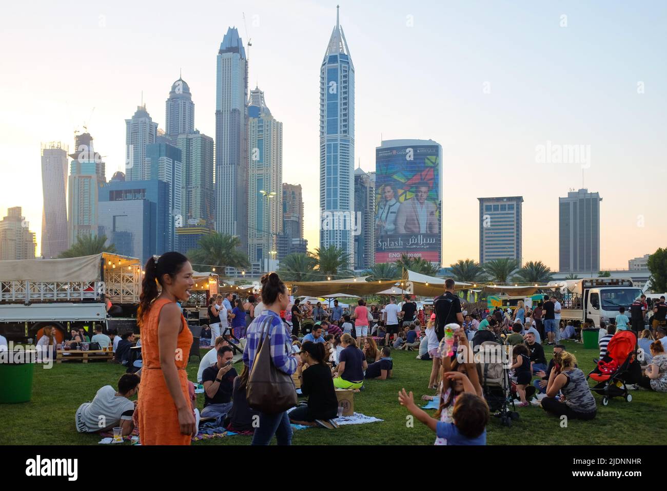 Dubai, UAE March 26, 2016 people relaxing on the grass during the