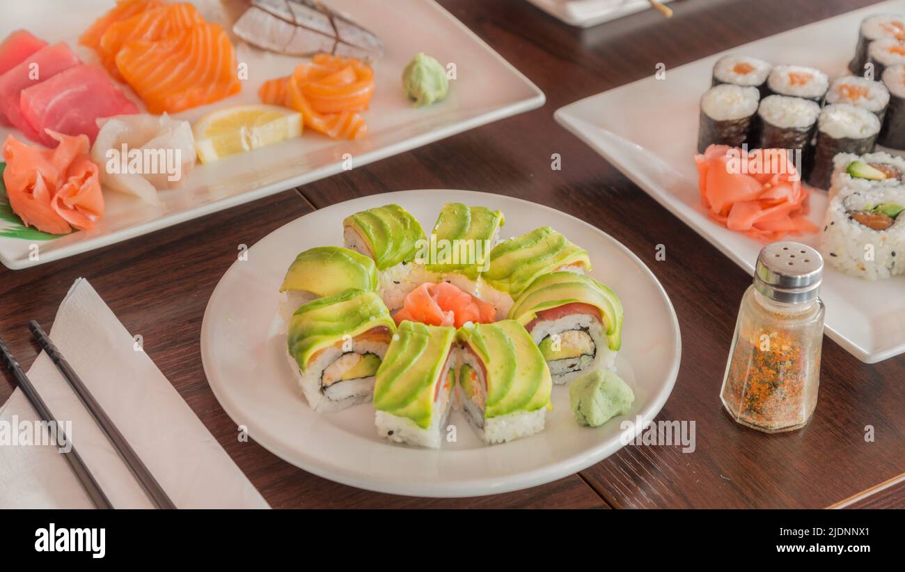 Surimi maki sushi with avocado on a table in a Japanese restaurant Stock Photo