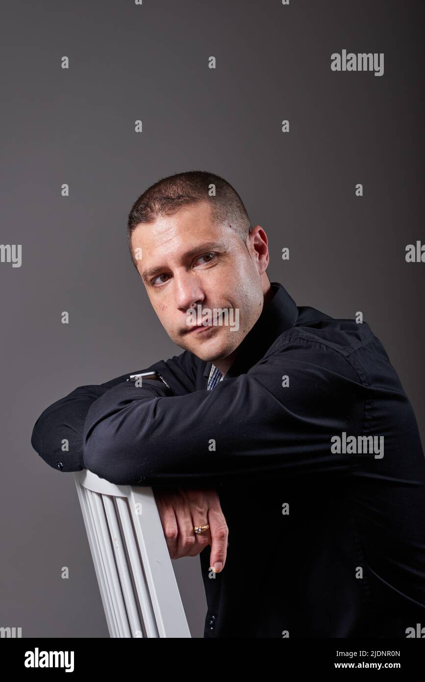Pensive black man sitting hi-res stock photography and images - Alamy