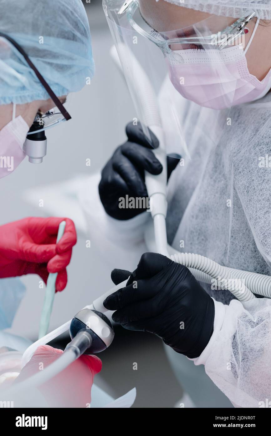 Woman dentist and assistant at work. Photo close up. High quality photo Stock Photo