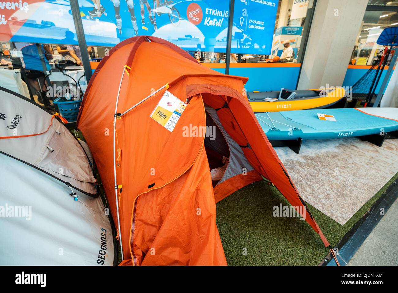 26 May 2022, Antalya, Turkey: Orange tent for mountaineers selling in Decathlon store Stock Photo