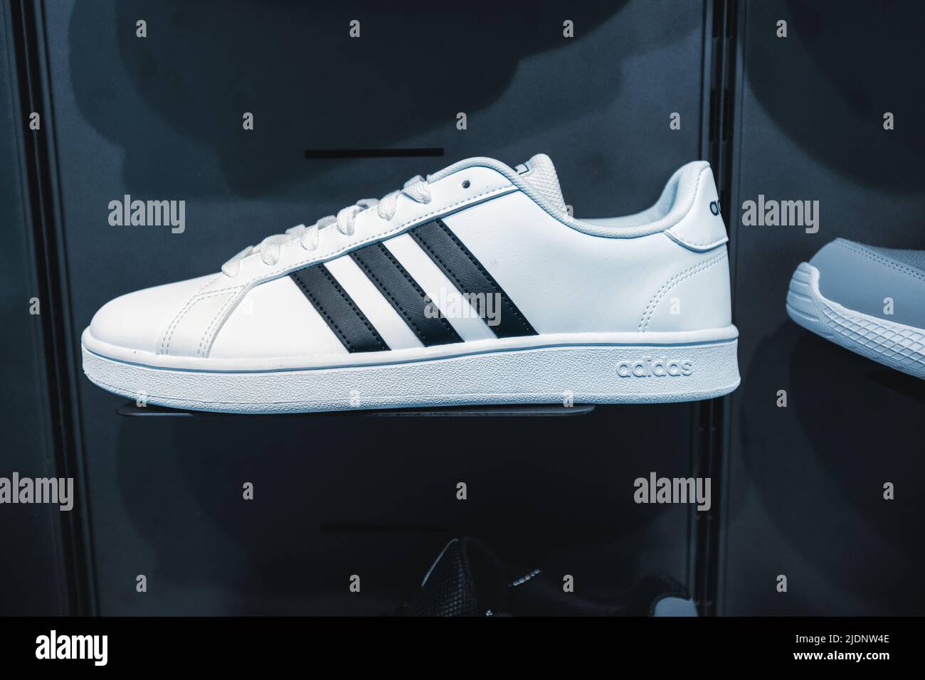 26 May 2022, Antalya, Turkey: Casual and trendy adidas shoes on a showcase  in original store Stock Photo - Alamy
