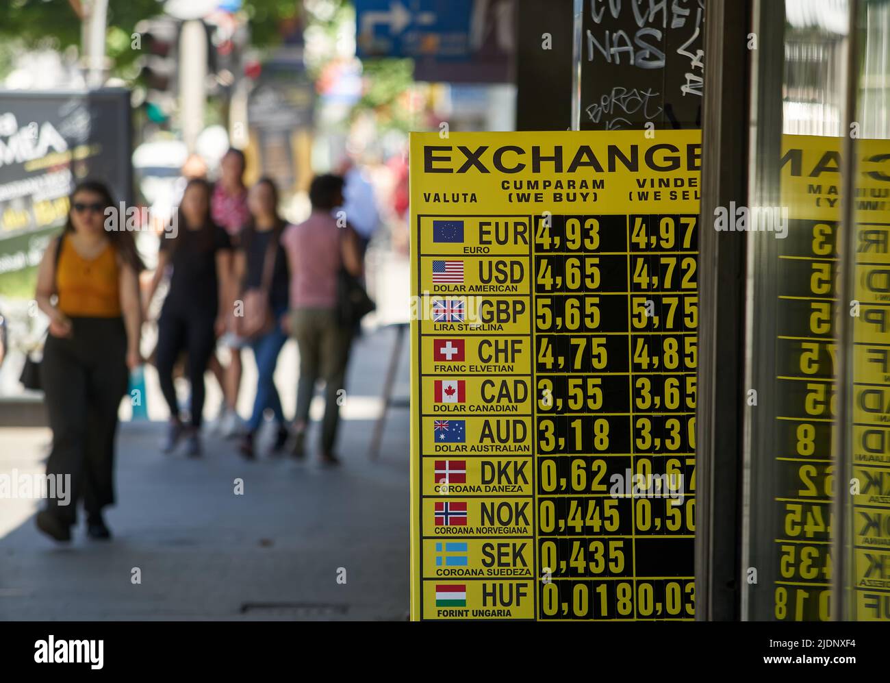 Bucharest, Romania - June 22, 2022: The exchange rate of the Leu-Euro, near the psychological threshold of 5 lei, is displayed on a yellow board at th Stock Photo