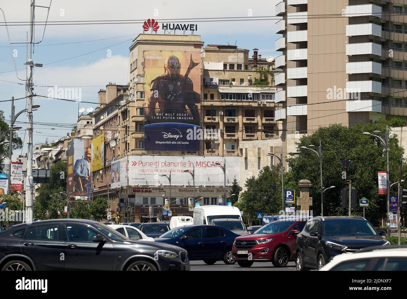 Bucharest, Romania - June 22, 2022: Extra large banner advertising The Mandalorian Star Wars TV Series on Disney+ is displayed on a building, in downt Stock Photo