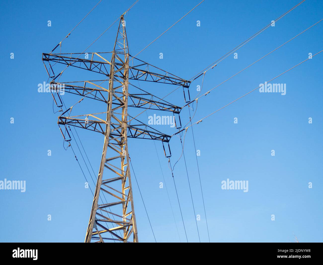 Power line. Pillar. Metal tower. Electricity in the city. Technologies ...