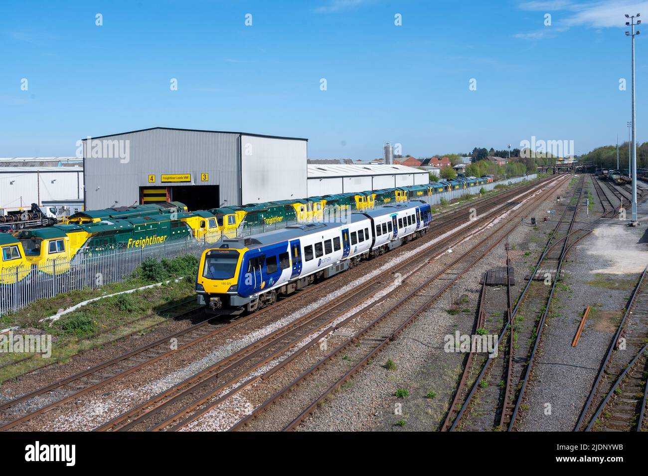 Northern Class 195 , Leeds, UK, 195024 1538 Leeds to Lincoln Central passing Freightliners Leeds Midland Road depot. 20th April 2022. Stock Photo