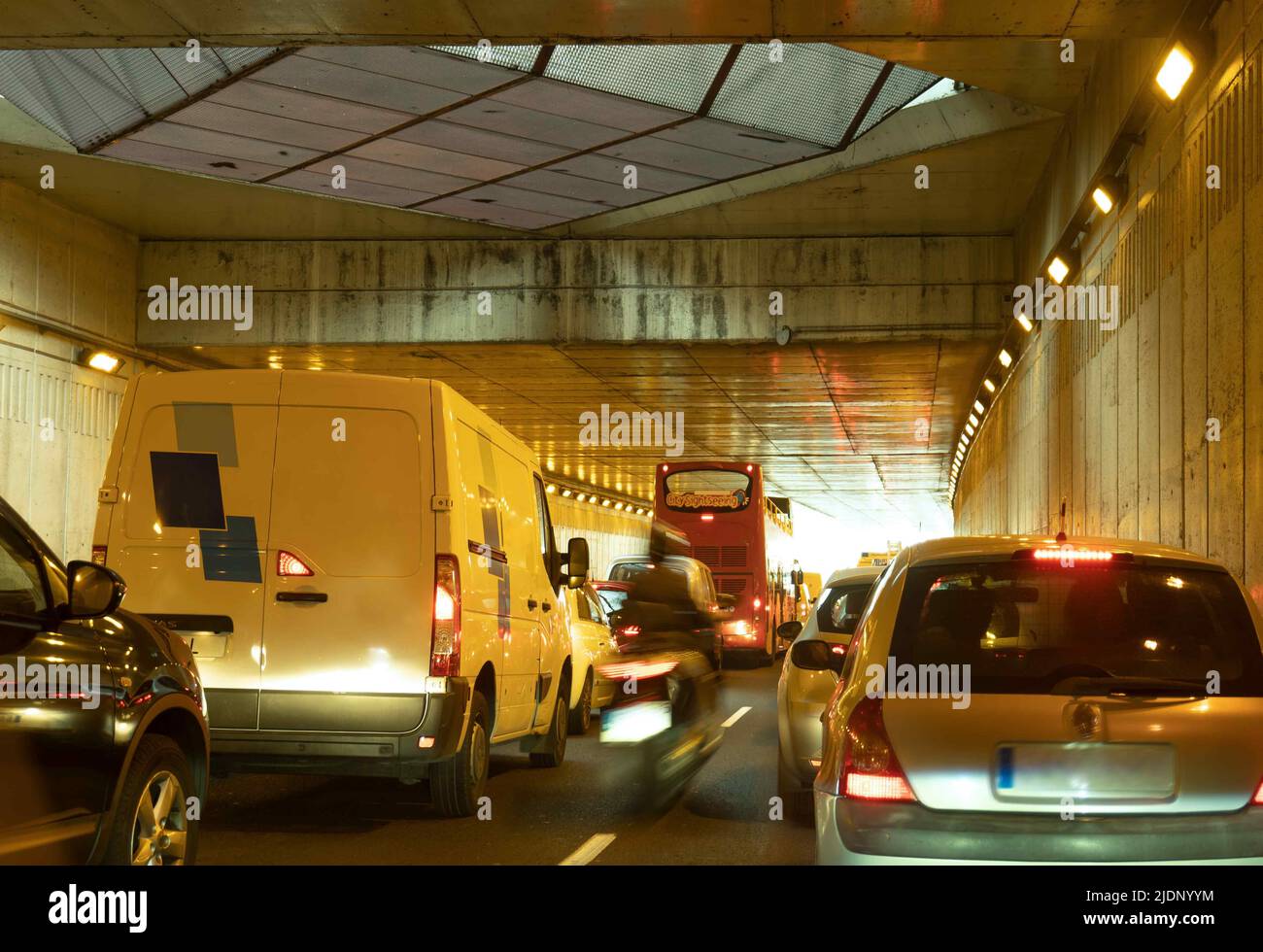 Heavy, jammed traffic of vehicles in city tunnel. Stock Photo