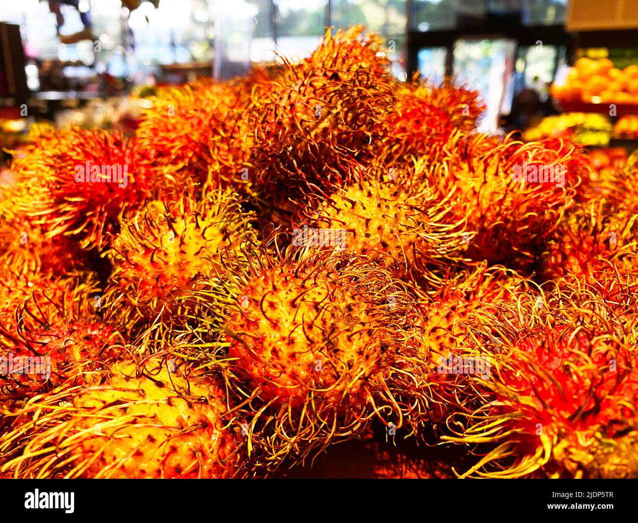 Rambutan fruit at the supermarket Stock Photo